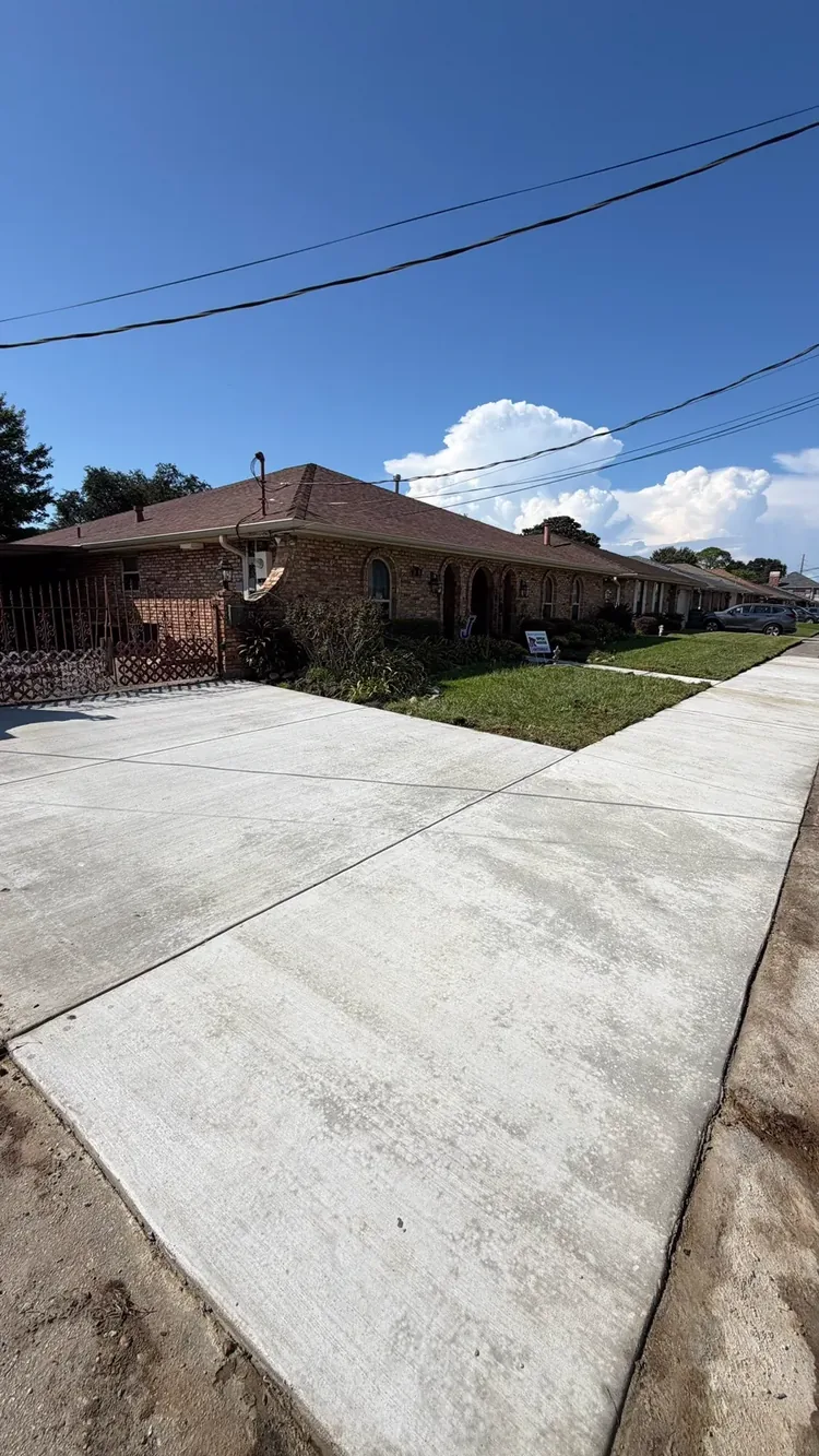 Replacement concrete driveway and sidewalk at the property